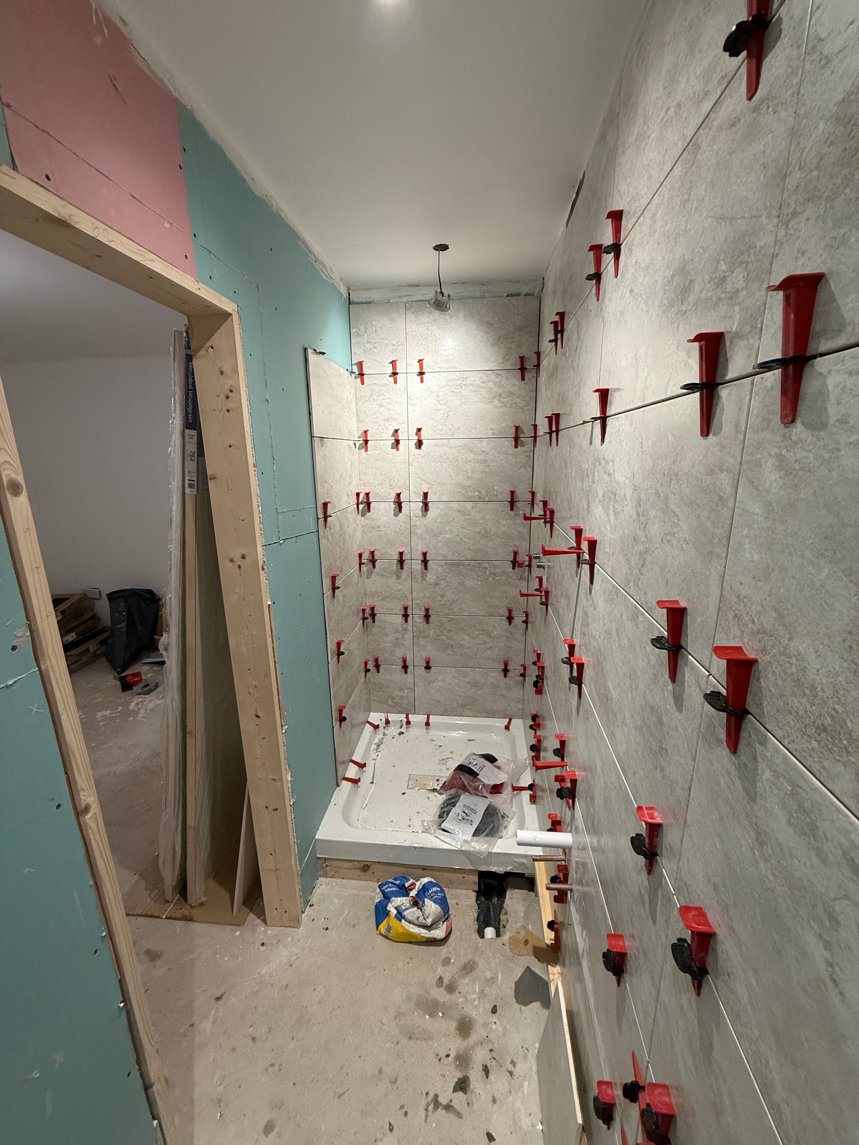 Completed bathroom renovation — finished flooring and walls